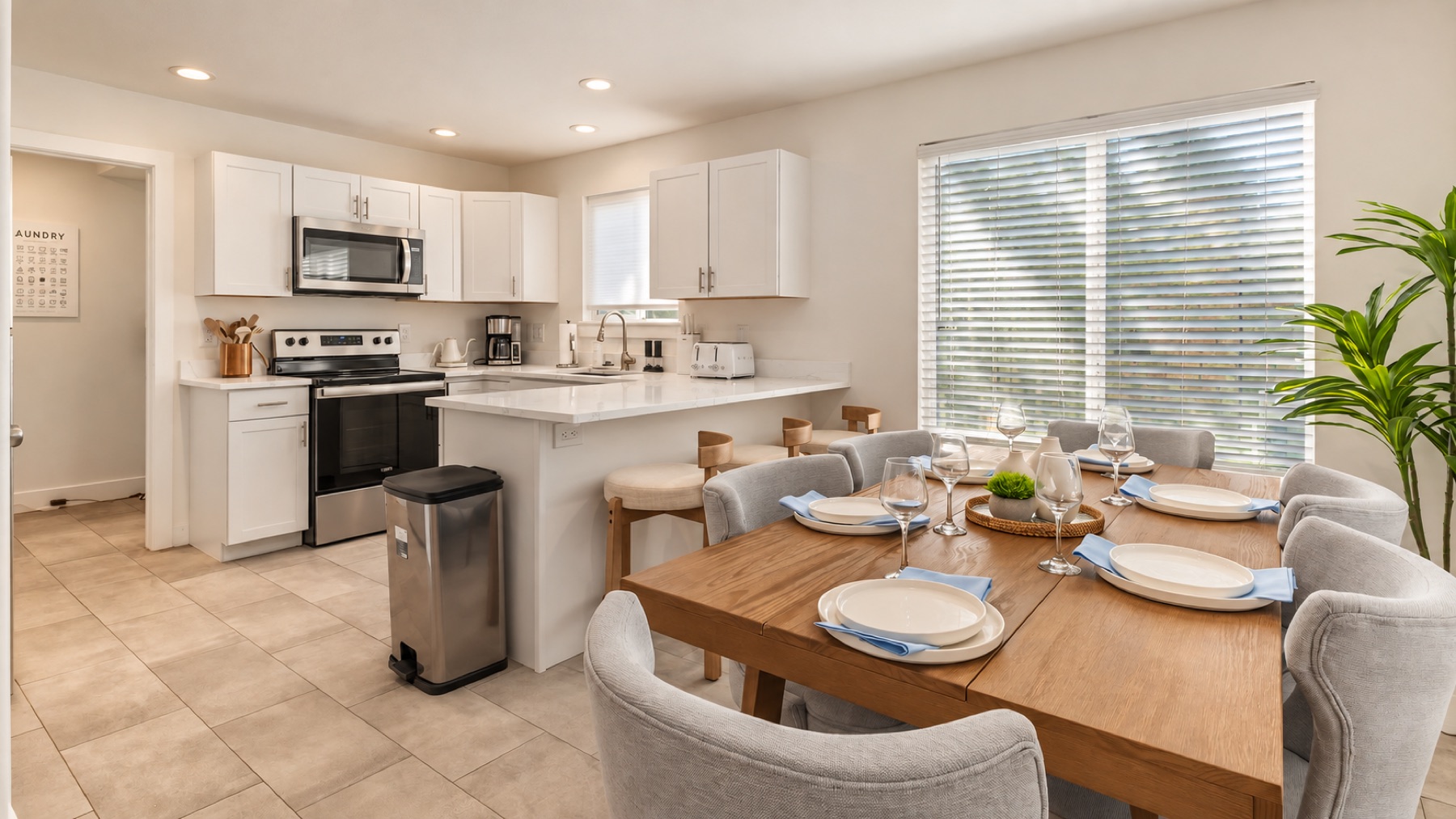The kitchen and the table in one frame, so whoever cooks never leaves the conversation.