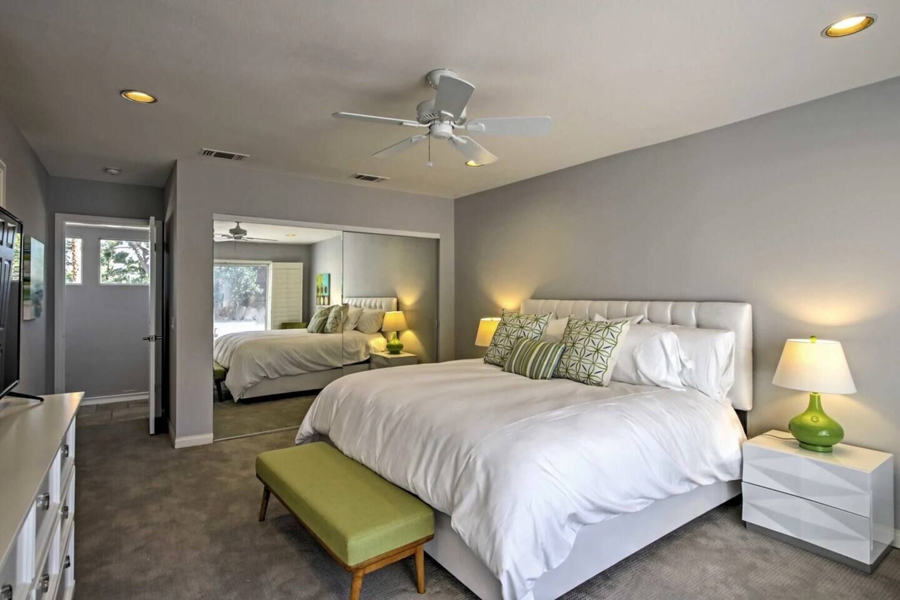 Suite three — king bed, bench, garden door