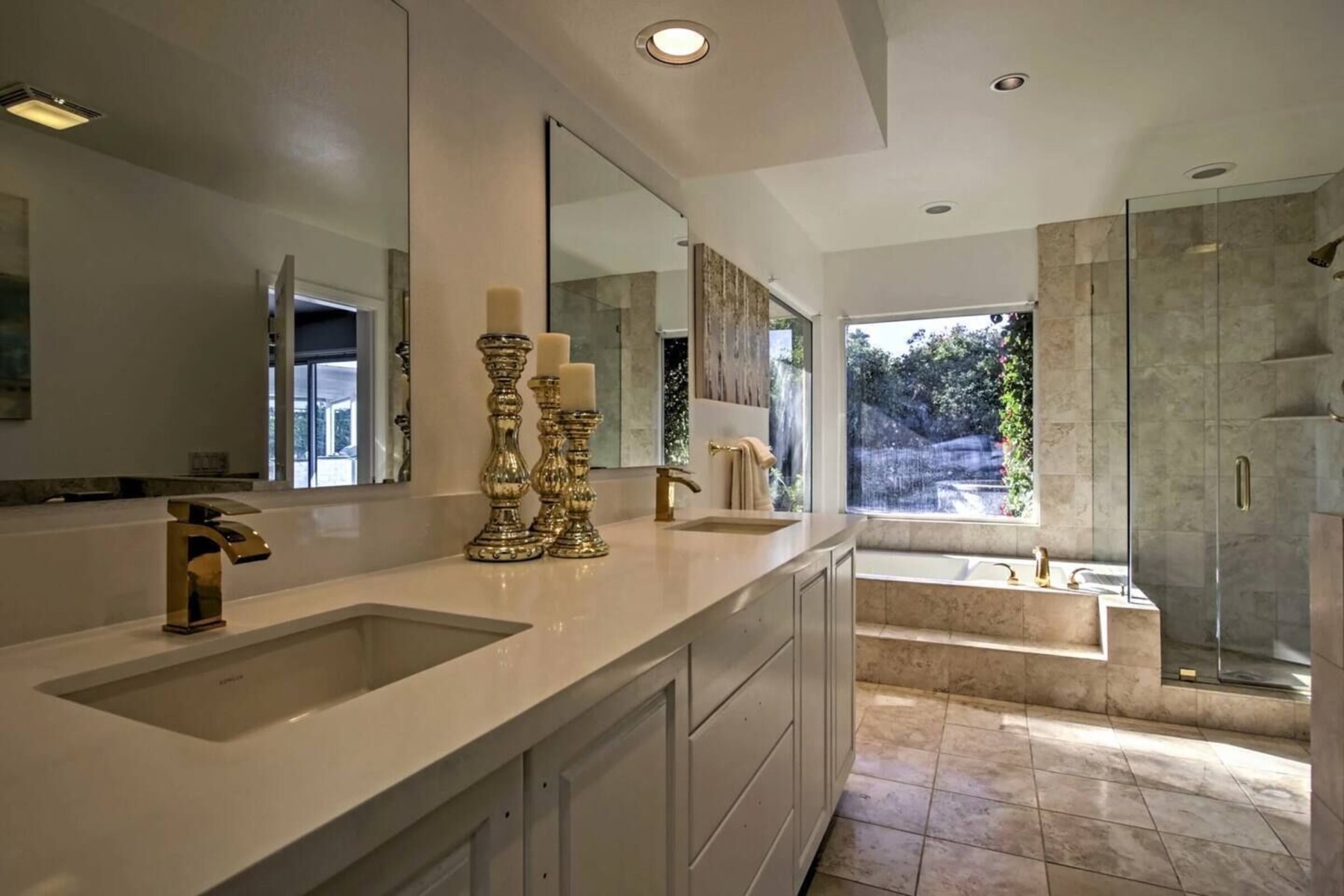 An en-suite bath — double vanity, tub and walk-in shower