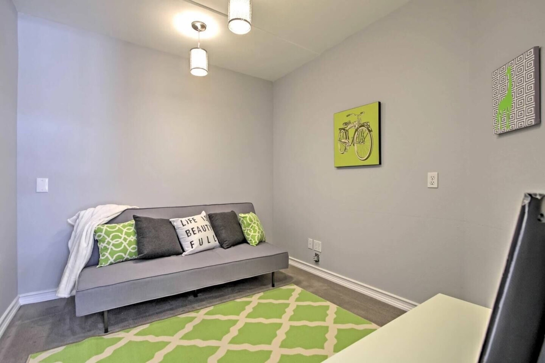 The kids corner — futon and play rug