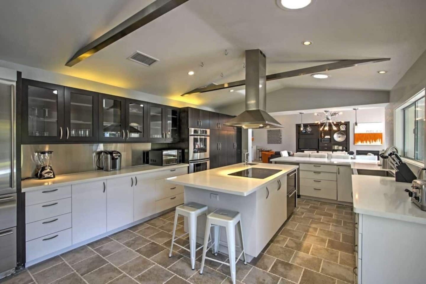 The kitchen — big island, stainless appliances