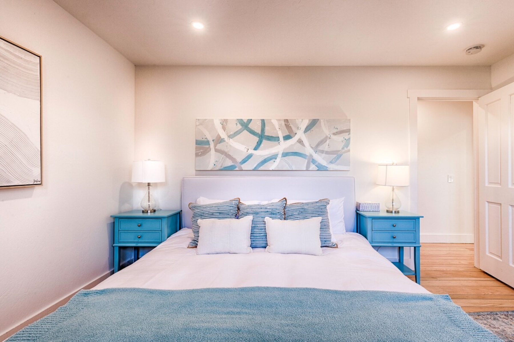 The middle bedroom — queen bed, closet and dresser