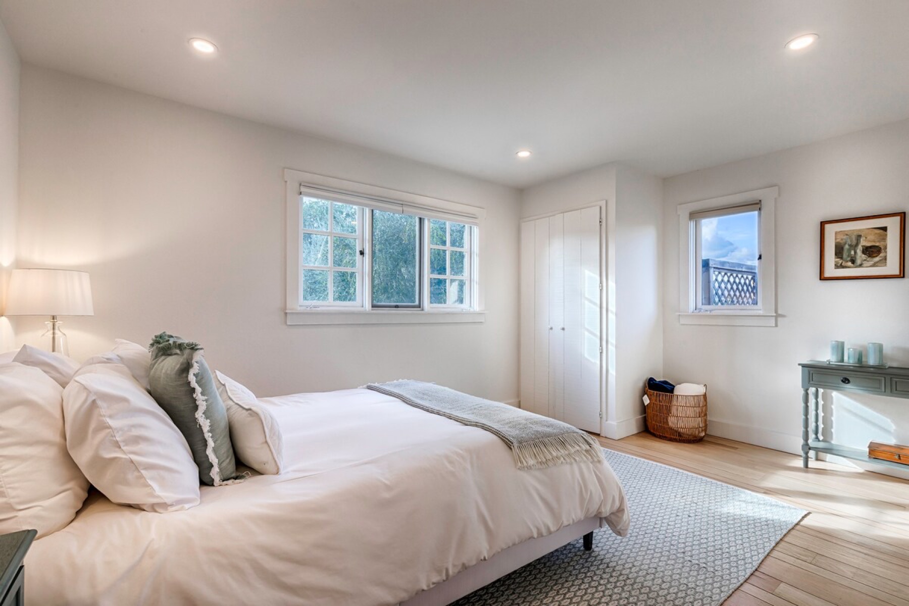 The west bedroom — a queen bed facing the western hills