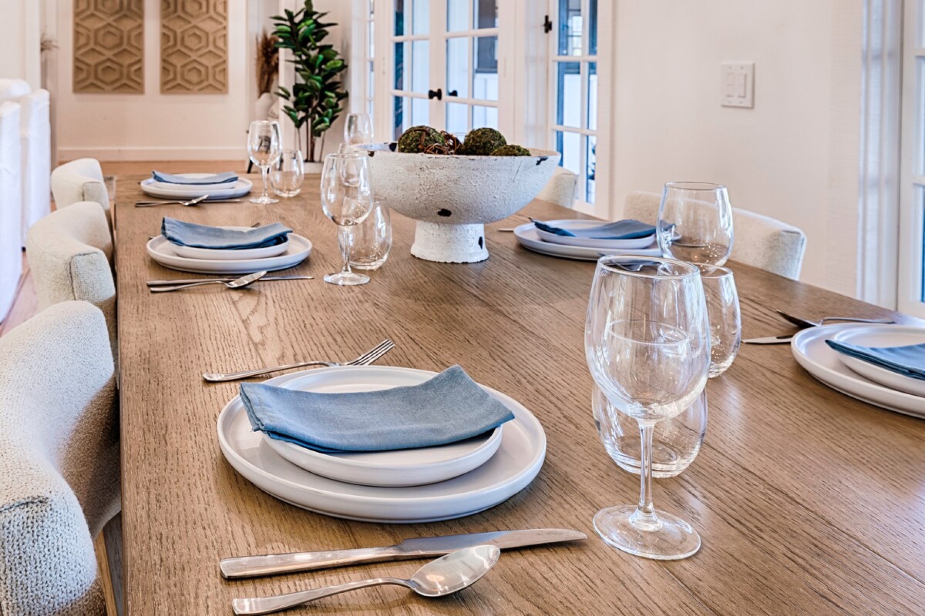 The dining room set for dinner beside the kitchen