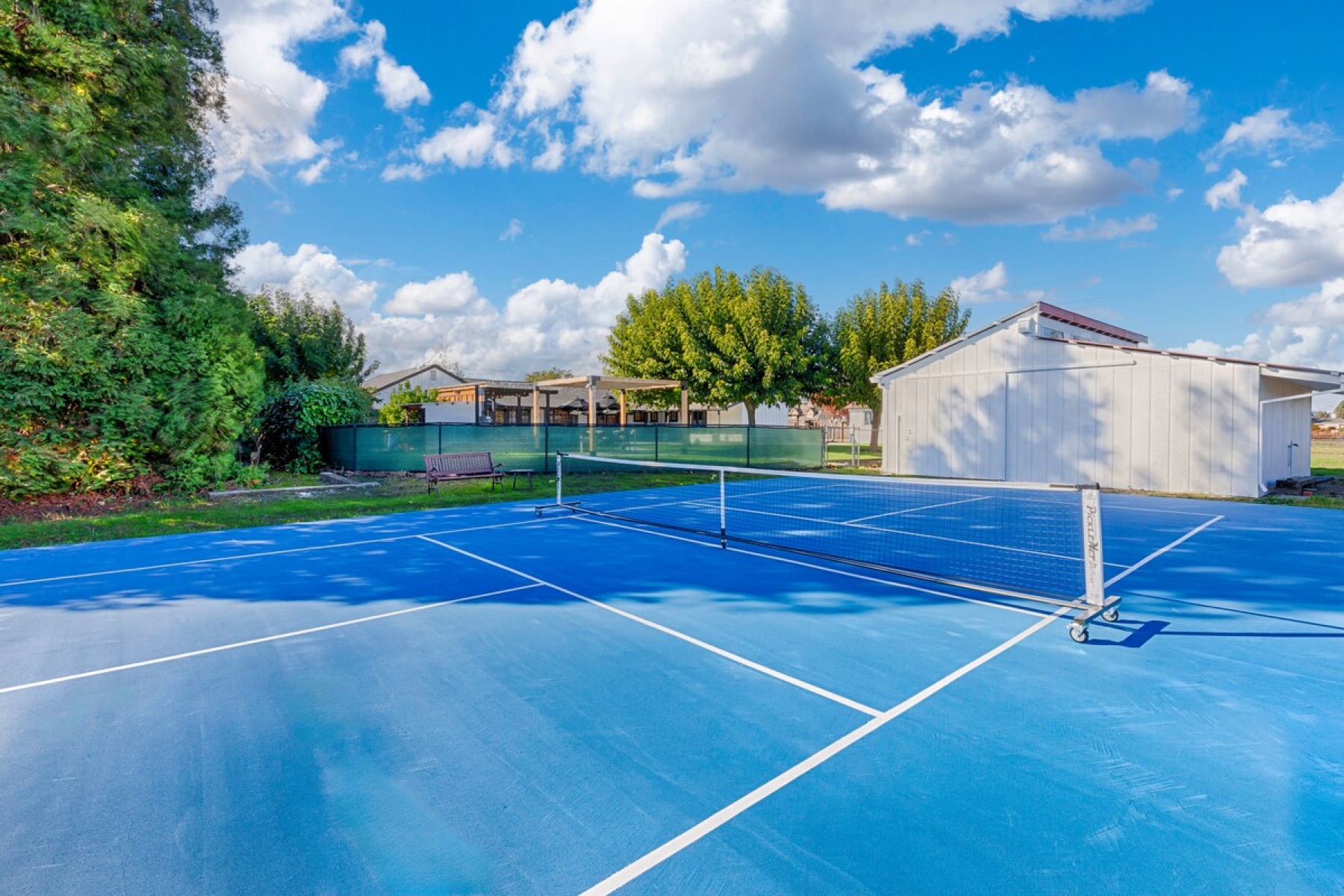 The private pickleball court under a big Sonoma sky