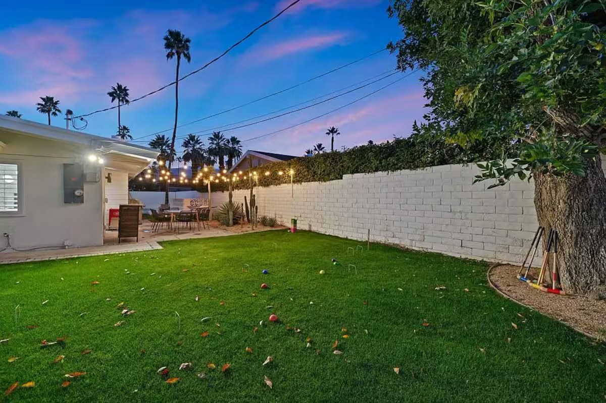 Landscaped private backyard with places to lounge and dine